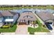 Beautiful waterfront single Gathering home with mature landscaping and neutral color palette at 7859 Yale Harbor Dr, Wesley Chapel, FL 33545