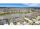 This vibrant community features well-manicured lawns, lush landscaping, views of a tranquil pond at 7859 Yale Harbor Dr, Wesley Chapel, FL 33545