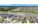 This vibrant community features well-manicured lawns, lush landscaping, views of a tranquil pond, and a Gathering friendly vibe at 7859 Yale Harbor Dr, Wesley Chapel, FL 33545