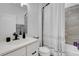 Modern bathroom featuring white vanity, black fixtures, and tub shower combination at 7859 Yale Harbor Dr, Wesley Chapel, FL 33545