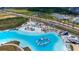 Enjoy the crystal lagoon with sandy beaches, sun loungers, and a waterpark in this exclusive community at 7859 Yale Harbor Dr, Wesley Chapel, FL 33545