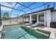 Inviting pool deck features lounge chairs and seamless flow to the main house at 7859 Yale Harbor Dr, Wesley Chapel, FL 33545
