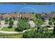 Aerial view of a waterfront property on a lake in a quiet residential neighborhood at 7864 Grande Shores Dr, Sarasota, FL 34240