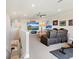 Lower-level entertainment area with comfortable seating, TV and exercise equipment providing comfort and fun at 7864 Grande Shores Dr, Sarasota, FL 34240