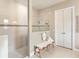 Modern bathroom showcasing a frameless glass shower, a comfortable bench, and bright lighting at 7864 Grande Shores Dr, Sarasota, FL 34240