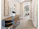 Inviting hallway featuring a decorative wooden console table, creating a warm and stylish entry point to the home at 7864 Grande Shores Dr, Sarasota, FL 34240