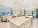 Spacious kitchen with a large island, connecting to the living and dining areas, perfect for entertaining at 7864 Grande Shores Dr, Sarasota, FL 34240