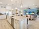Bright open concept kitchen, showcasing seamless flow to the living room and modern appliances at 7864 Grande Shores Dr, Sarasota, FL 34240