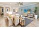 Comfortable living room with a plush sofa, stylish decor, and a blue accent wall at 7864 Grande Shores Dr, Sarasota, FL 34240