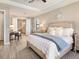 Spacious main bedroom featuring an ensuite bathroom, desk and serene decor at 7864 Grande Shores Dr, Sarasota, FL 34240