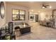 Spacious outdoor patio with comfortable seating, a dining area, and an outdoor kitchen at 7864 Grande Shores Dr, Sarasota, FL 34240
