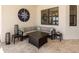 Comfortable patio seating area with a firepit table, perfect for enjoying the outdoors at 7864 Grande Shores Dr, Sarasota, FL 34240