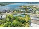 An aerial view shows the community amenities, including the pool, clubhouse, and tennis courts at 8067 Waterbend Trl, Sarasota, FL 34240