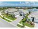 An eye-level aerial view of a lovely property near a shimmering lake showcases the home's premier location at 8067 Waterbend Trl, Sarasota, FL 34240