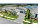 An eye-level aerial view of a lovely home near a shimmering lake showcases the property's premier location at 8067 Waterbend Trl, Sarasota, FL 34240