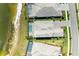 Aerial view of well-appointed homes in a desirable lakeside neighborhood; some homes feature pools at 8067 Waterbend Trl, Sarasota, FL 34240