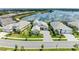Daytime aerial view of the home with scenic lake and community views at 8067 Waterbend Trl, Sarasota, FL 34240