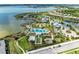 An aerial view of the community's luxurious pool and amenity center near the serene lake at 8067 Waterbend Trl, Sarasota, FL 34240