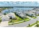 Aerial view showcases a beautiful home near the water with lush landscaping and a scenic view at 8067 Waterbend Trl, Sarasota, FL 34240