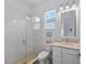 Bathroom featuring a glass shower, tile floor, and neutral decor at 8067 Waterbend Trl, Sarasota, FL 34240