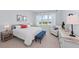 Bright bedroom with a large window and stylish furnishings at 8067 Waterbend Trl, Sarasota, FL 34240