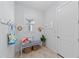 Inviting entryway with seating, decor, and functional storage for a welcoming first impression at 8067 Waterbend Trl, Sarasota, FL 34240