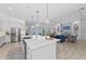 Gourmet kitchen featuring a large island with a view of the water at 8067 Waterbend Trl, Sarasota, FL 34240