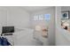 Second floor landing with a workspace and natural light at 8067 Waterbend Trl, Sarasota, FL 34240