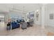 Bright and airy living room featuring stylish decor, light wood flooring, and lake views at 8067 Waterbend Trl, Sarasota, FL 34240