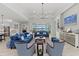 Spacious living room boasts plenty of natural light and views of the lake at 8067 Waterbend Trl, Sarasota, FL 34240