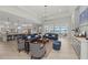 Bright and airy open concept living space with hardwood floors and lake views at 8067 Waterbend Trl, Sarasota, FL 34240