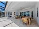 Inviting outdoor living space with dining, seating, and scenic lake views at 8067 Waterbend Trl, Sarasota, FL 34240