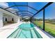 Long screened pool and spa that extends from the patio to the yard at 8067 Waterbend Trl, Sarasota, FL 34240