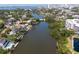 Aerial view of a waterfront community with canals, docks, and residential buildings at 850 S Tamiami Trl # 836, Sarasota, FL 34236
