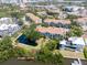 Aerial view of residences nestled amongst lush greenery, offering serene water views and community amenities at 850 S Tamiami Trl # 836, Sarasota, FL 34236