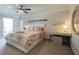 Bright bedroom with a ceiling fan and a balcony. Stylish and serene design at 850 S Tamiami Trl # 836, Sarasota, FL 34236