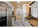 Bright kitchen featuring white cabinets, stainless steel appliances, and granite countertops at 850 S Tamiami Trl # 836, Sarasota, FL 34236