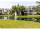 Scenic pond with fountain surrounded by lush landscaping, adding a tranquil and picturesque element to the community at 850 S Tamiami Trl # 836, Sarasota, FL 34236