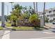 Community sign for Central Park II with lush landscaping and palm trees on a sunny day at 850 S Tamiami Trl # 836, Sarasota, FL 34236