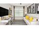 Stylish home office with a modern desk, comfortable seating, and large windows, ideal for remote work at 8561 Snowfall St, Sarasota, FL 34241