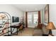 Modern home office with a functional layout, sleek furniture, and ample natural light for productivity at 8561 Snowfall St, Sarasota, FL 34241