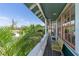 Scenic balcony with tropical greenery views, ideal for relaxing and enjoying the outdoors at 861 Nectar Rd, Venice, FL 34293