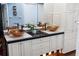 Bathroom with custom sink bowls, modern fixtures, and ample cabinet space offers style and functionality at 861 Nectar Rd, Venice, FL 34293