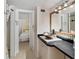 Modern bathroom boasts stylish sink, ample counter space, and neutral tones for a serene ambiance at 861 Nectar Rd, Venice, FL 34293