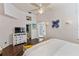 This bright bedroom offers ample space, a queen bed, stylish decor, and abundant natural light at 861 Nectar Rd, Venice, FL 34293