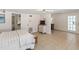 Spacious bedroom featuring tile floors, modern light fixtures, and ample natural light for relaxation at 861 Nectar Rd, Venice, FL 34293