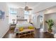 Airy bedroom boasts wood floors, neutral palette, coastal decor, and a bright, inviting atmosphere at 861 Nectar Rd, Venice, FL 34293