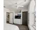 Bedroom featuring a large window, ceiling fan, and convenient built-in storage at 861 Nectar Rd, Venice, FL 34293
