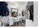 Walk-in closet with built-in vanity, mirror, and ample hanging space at 861 Nectar Rd, Venice, FL 34293