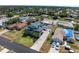 Aerial of a two-story home with mature trees, long driveway, and well-maintained landscaping at 861 Nectar Rd, Venice, FL 34293